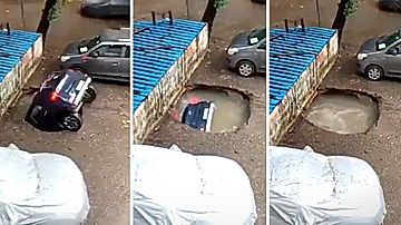 突然の陥没に飲み込まれる車